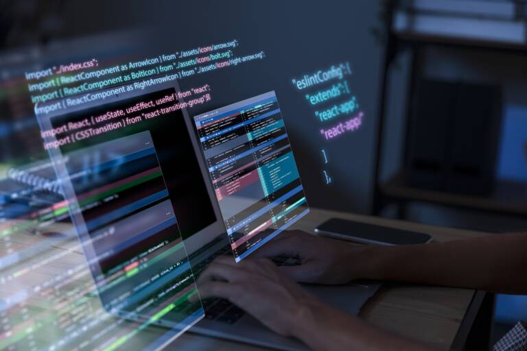 Programming background with person working with codes computer